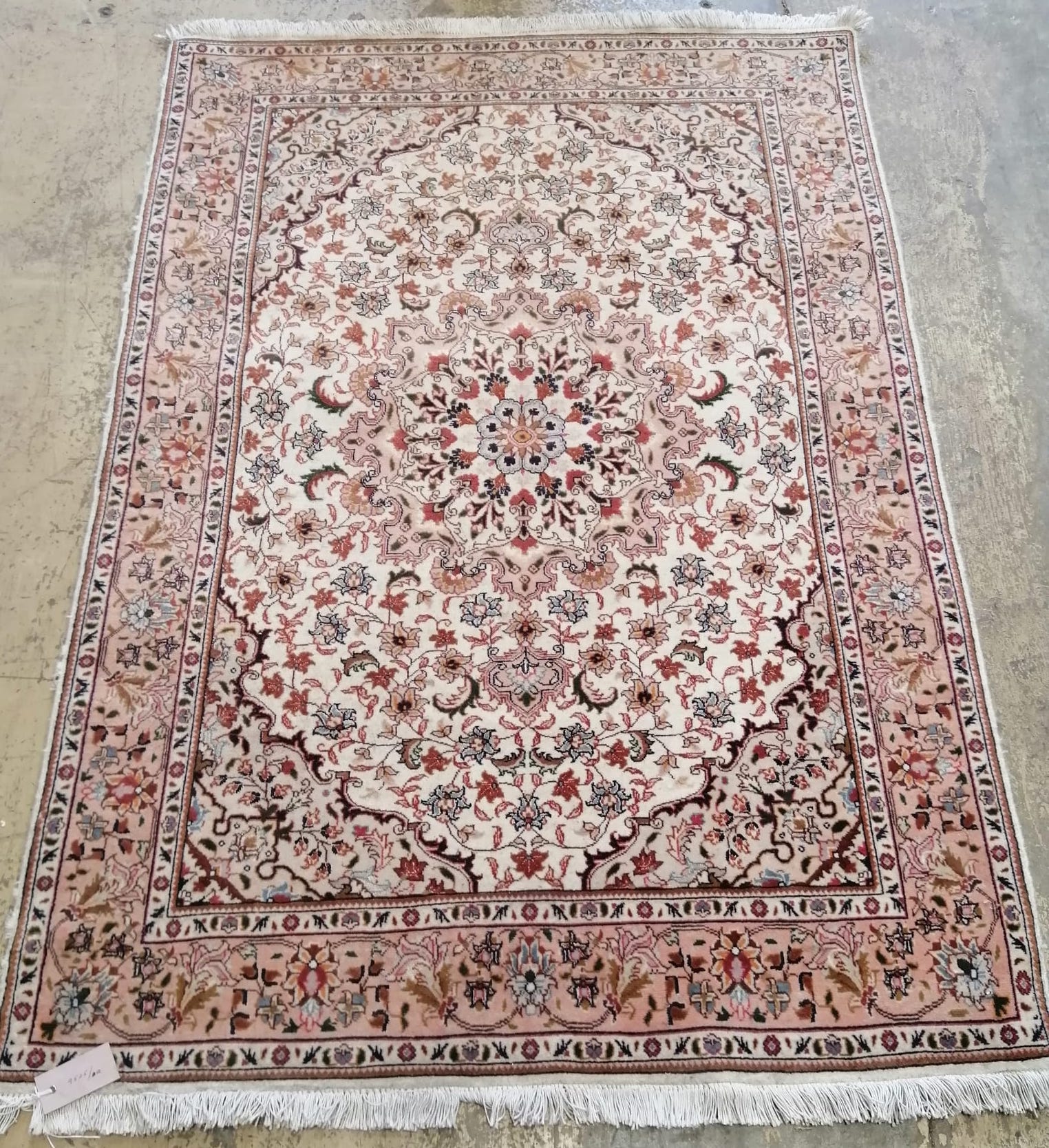 A Persian cream ground runner, 147 x 101cm